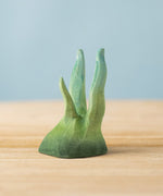 The Bumbu hand carved small wooden seaweed toy, for making underwater play scenes