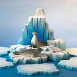 Bumbu Toys harp seal pup, curious harp seal and harp seal placed on an ice berg in a small world play scene. 