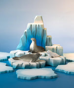 Bumbu Toys harp seal pup, curious harp seal and harp seal placed on an ice berg in a small world play scene. 