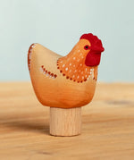Bumbu handcrafted wooden brown festive hen figure standing on wooden base for Grimms celebration ring