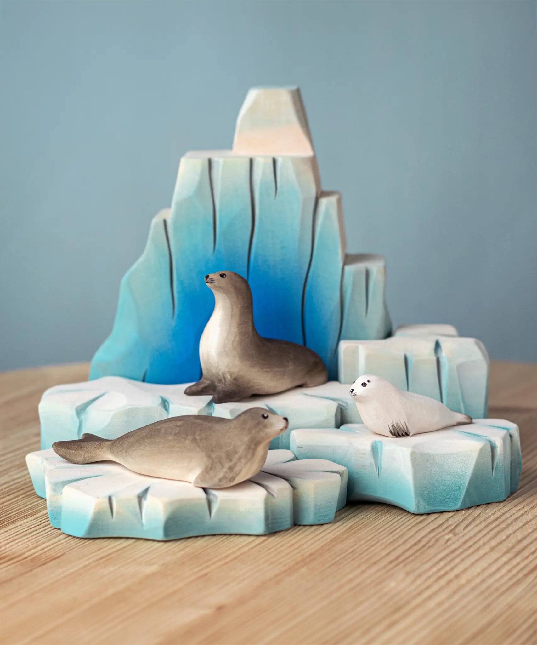 Bumbu handcrafted wooden iceberg  with seal figures resting on individual blocks