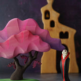 Bumbu Wooden Halloween Handmade Vampire Toy next to Pink Bumbu Japanese Maple Tree with bats