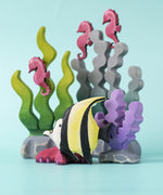 A Bumbu Toys Moorish Idol Fish placed at the front of an underwater themed small world play scene. 