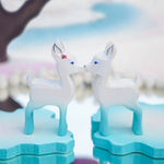 Close up of two Bumbu fawn toys stood face to face on some Bumbu ice floe blocks