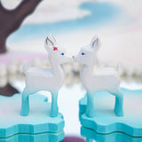 Close up of two Bumbu fawn toys stood face to face on some Bumbu ice floe blocks