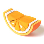 Close up of the Bumbu eco-friendly plastic free toy tangerine on a white background