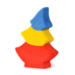 Bumbu hand carved wooden tree toy in the Romanian flag colours on a white background