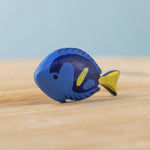 The Bumbu hand carved wooden Royal Blue Tang fish toy, hand painted in blue with yellow details. 