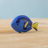The Bumbu hand carved wooden Royal Blue Tang fish toy, hand painted in blue with yellow details. 