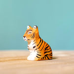 Bumbu Wooden Sitting Tiger Cub pictured on a blue background