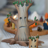 A large Bumbu spooky tree placed in front of a celebration ring. The small spooky tree can be seen blurred in the front. 