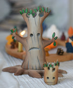A large Bumbu spooky tree placed in front of a celebration ring. The small spooky tree can be seen blurred in the front. 