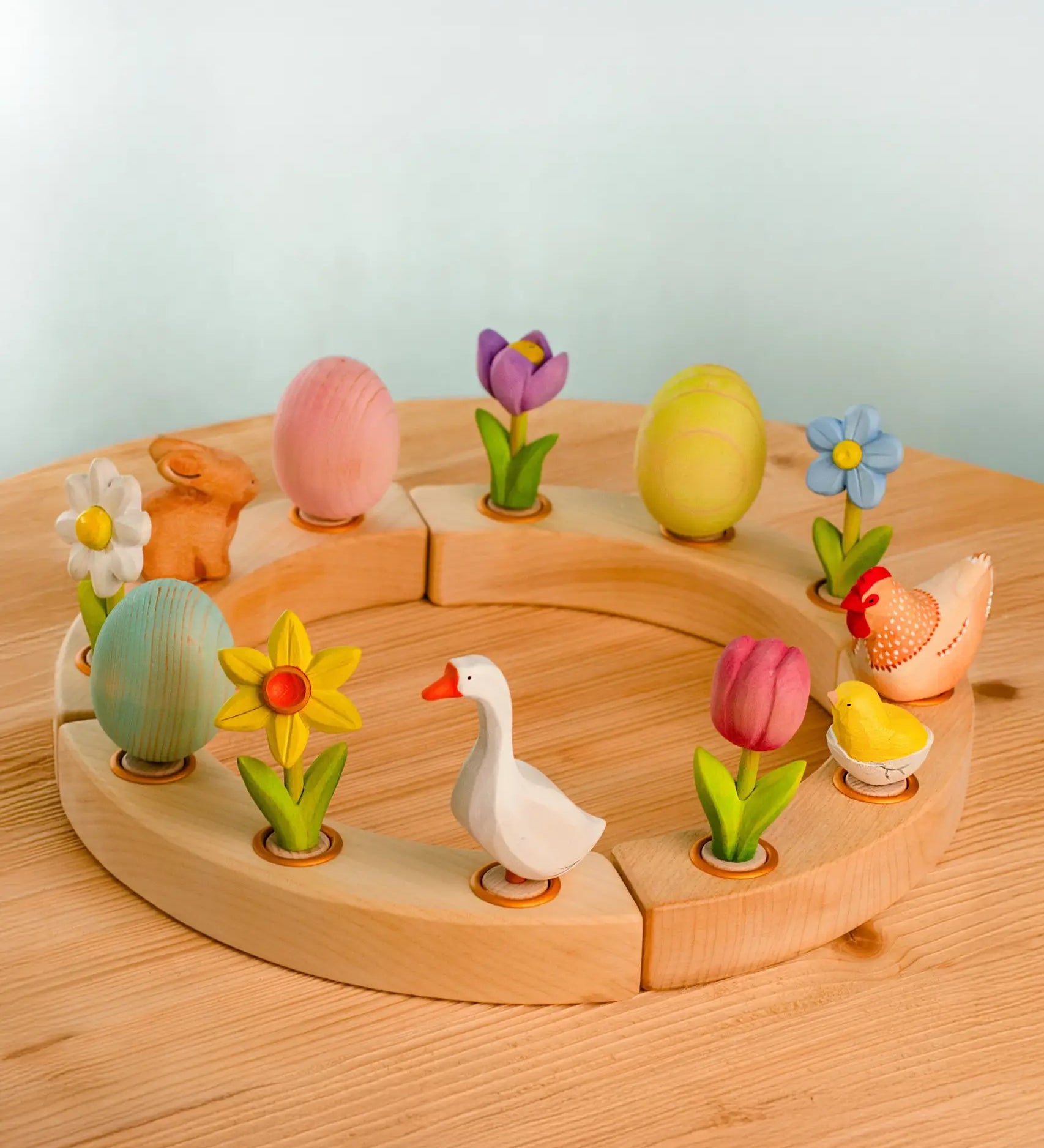 Wooden celebration ring with Bumbu spring festive decoration figures standing inside