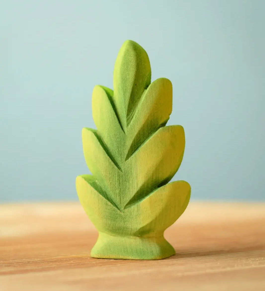 Bumbu Toys thuja shrub wooden toy scenery piece placed on a wooden surface.
