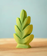 Bumbu Toys thuja shrub wooden toy scenery piece placed on a wooden surface.