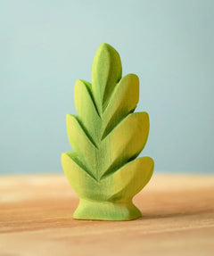 Bumbu Toys thuja shrub wooden toy scenery piece placed on a wooden surface.