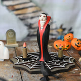Bumbu Toys Dracula The Vampire Wooden Halloween Figure placed on a wooden cobweb in the middle of a small world play scene with Bumbu Halloween and Autumn themed toys.
These expertly hand crafted items are part of a large range of wooden toys available here at Babipur.  