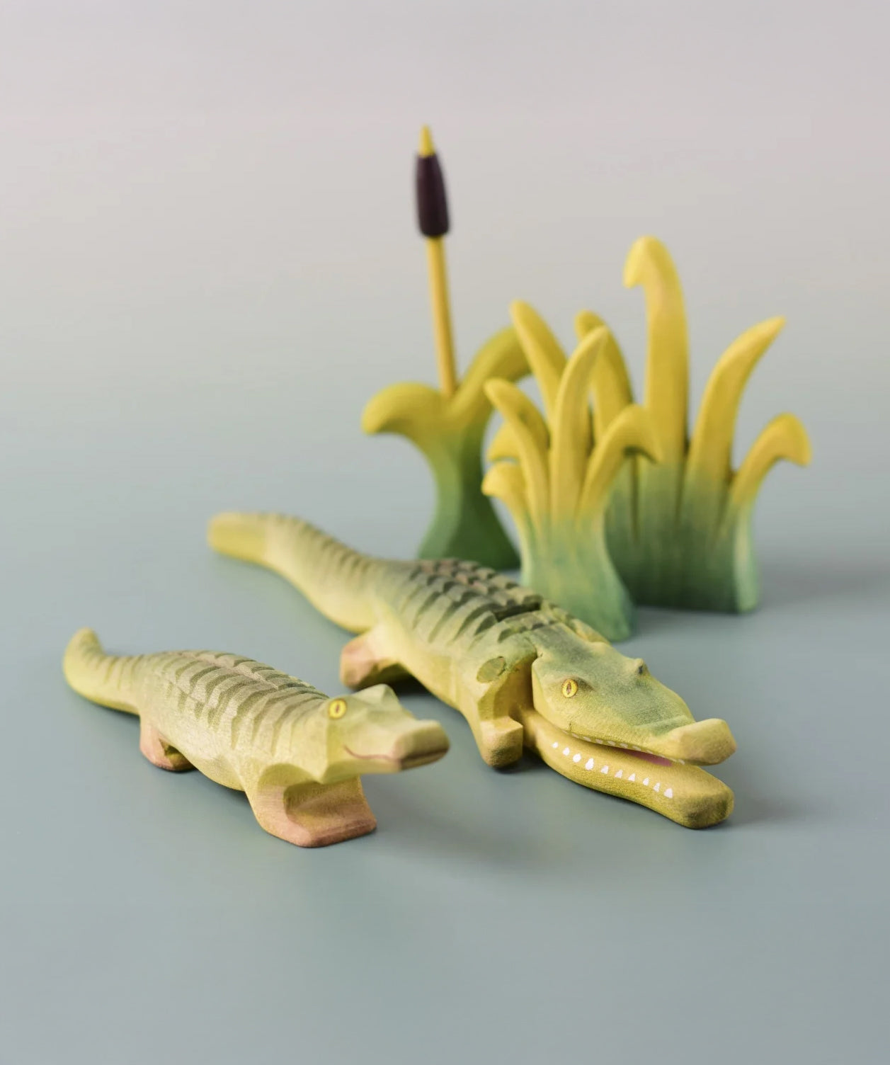 Bumbu's Wooden Reed's in small and large, in a scene with Bumbu's Crocodile, Baby Crocodile and Cattails.