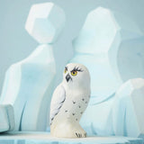 The Bumbu Toys Snowy Owl on a Bumbu ice flo in front of the Bumbu icy cliffs.