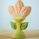 The Bumbu Toys Zia Spring Flower has a pinky peach coloured flower with purple detailing and a green coloured stem. 