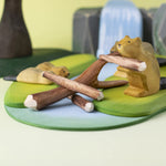 A Bumbu Toys Black Poplar Branch seen in a small world play set up with the Bumbu beavers, lake and waterfall in the background. 