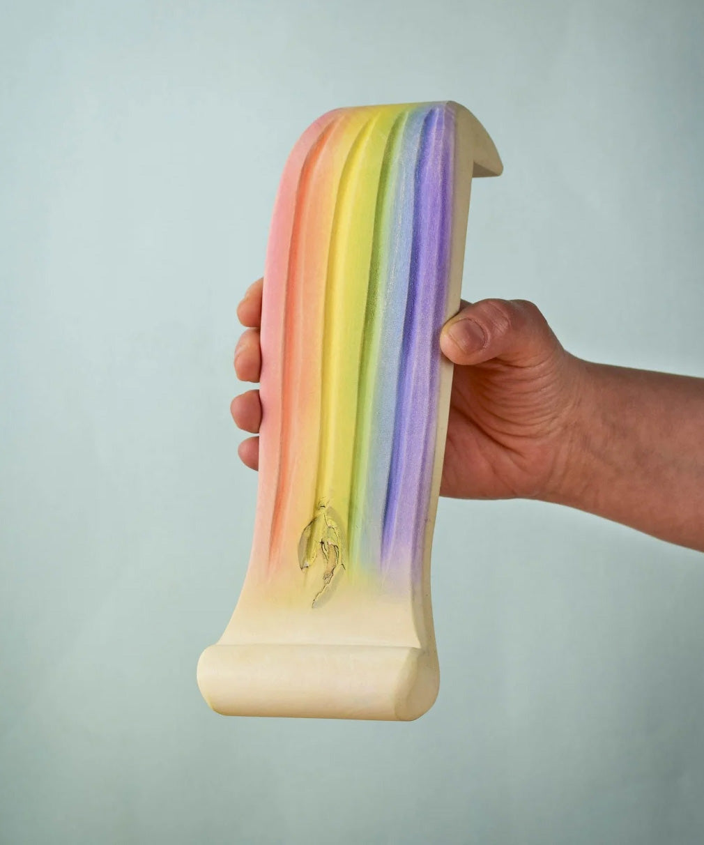 The Bumbu rainbow waterfall pictured being held up in an adult's hand. 