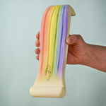 The Bumbu rainbow waterfall pictured being held up in an adult's hand. 