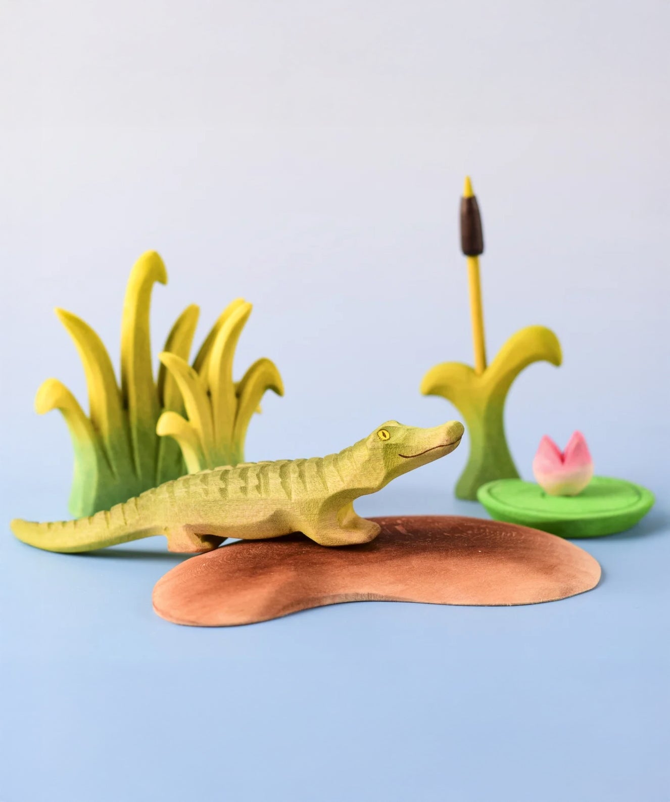 
Bumbu Toys' Little Island in a scene with Bumbu's baby Crocodile, Reed, Water Lily and Cattails.
