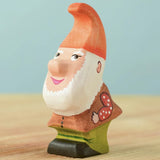The Bumbu Toys Tumble Dwarf wooden figure has a white beard and a red coloured hat.