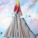 A Bumbu volcano with a wonder cloth in the background surrounded by glass marbles. 