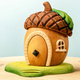 Bumbu toys handcrafted wooden acorn house with removable door, cut out window and green base