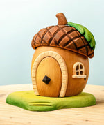 Bumbu toys handcrafted wooden acorn house with removable door, cut out window and green base