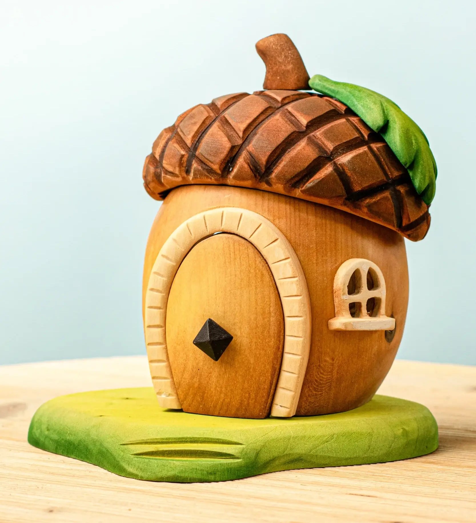 Bumbu toys handcrafted wooden acorn house with removable door, cut out window and green base
