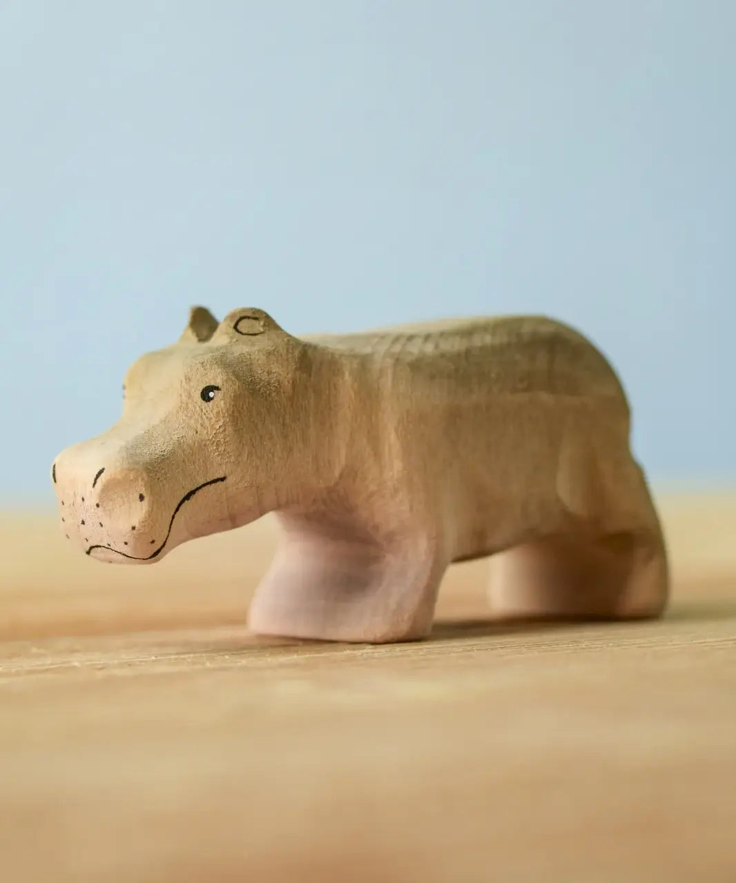 Bumbu toys handcrafted wooden grey standing baby hippo figure with painted facial features
