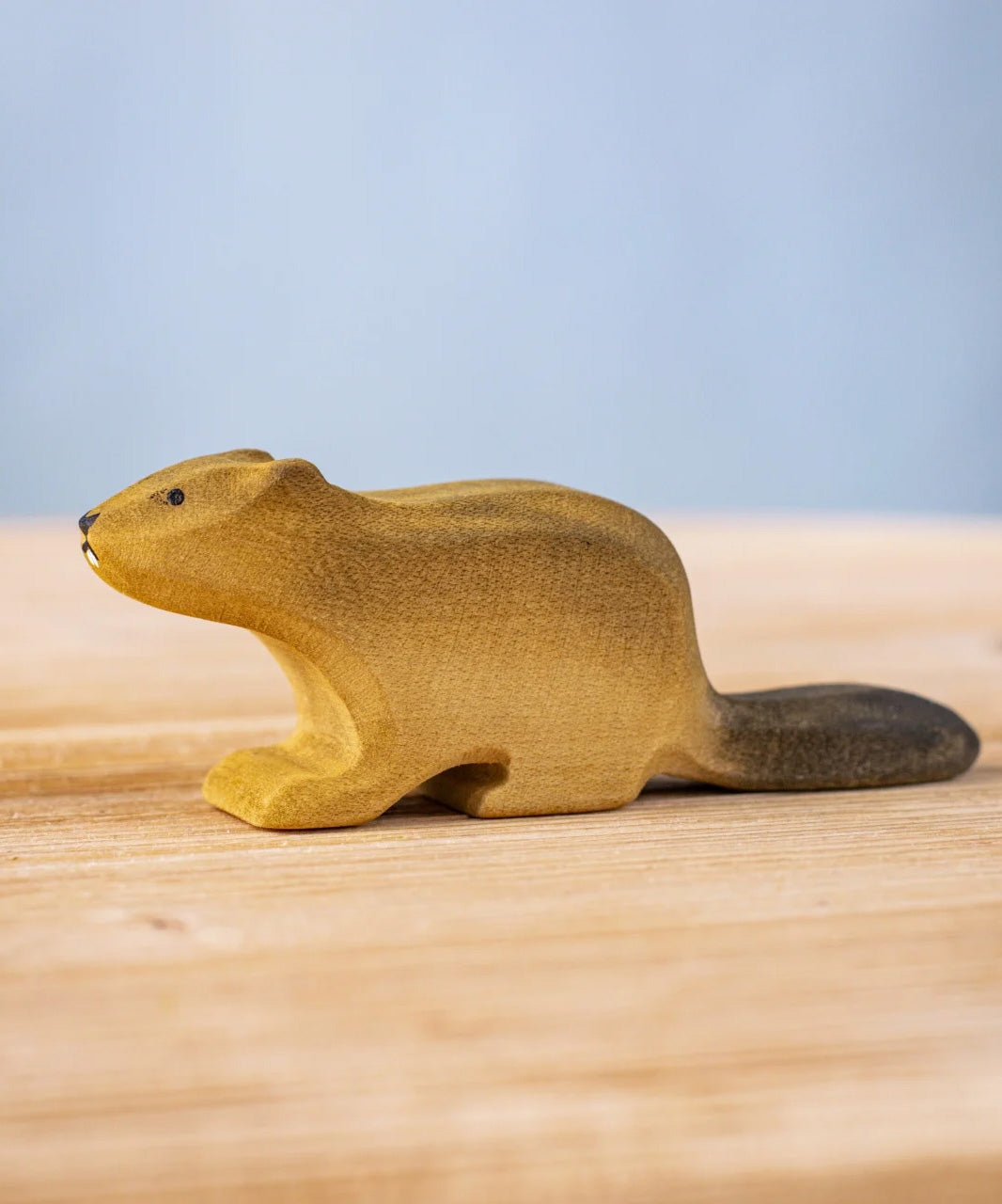 Bumbu wooden beaver figure standing on a wooden board