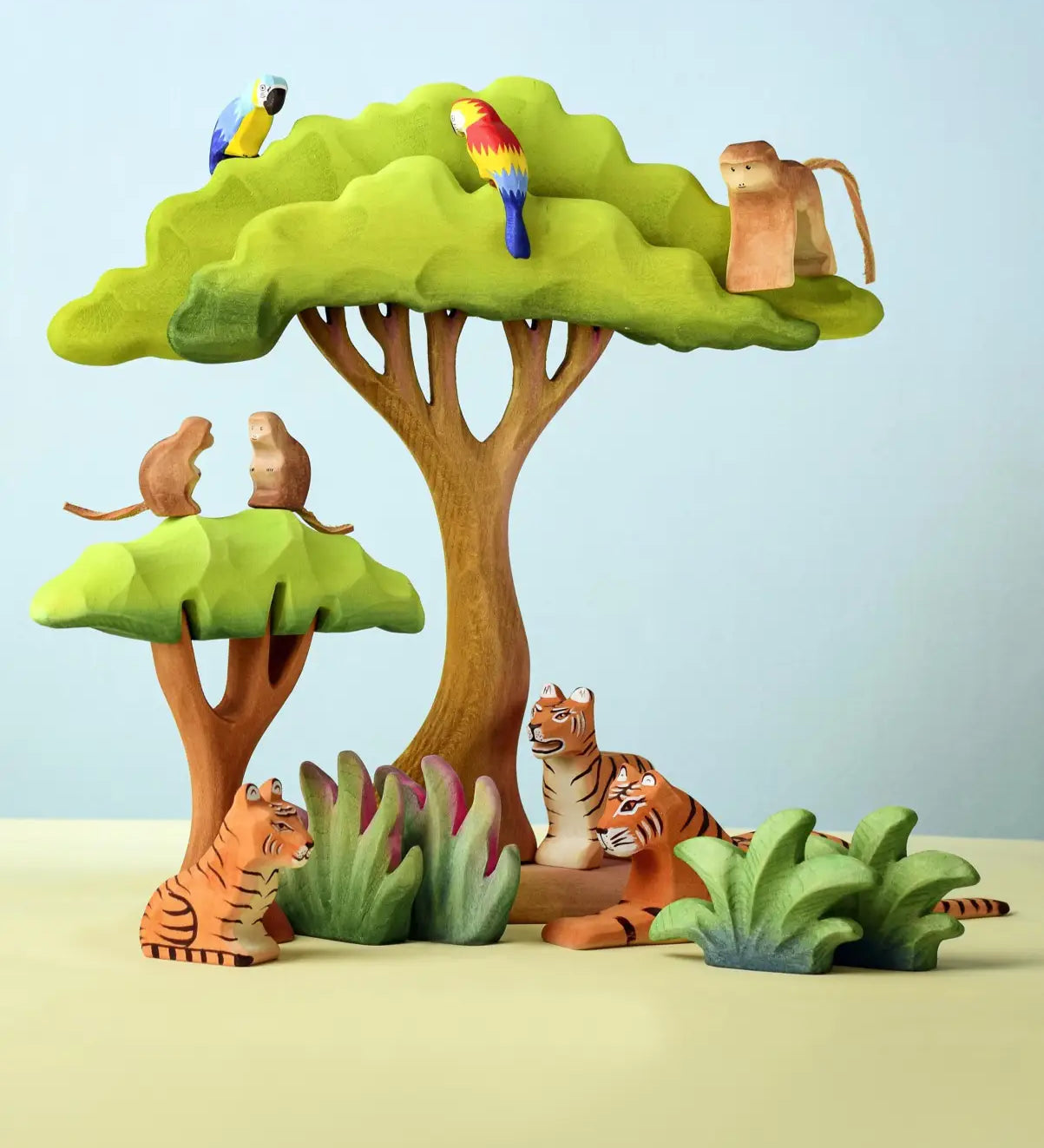 A playscene using Bumbu wooden trees, grass and animal figures including parrots, monkeys and tigers