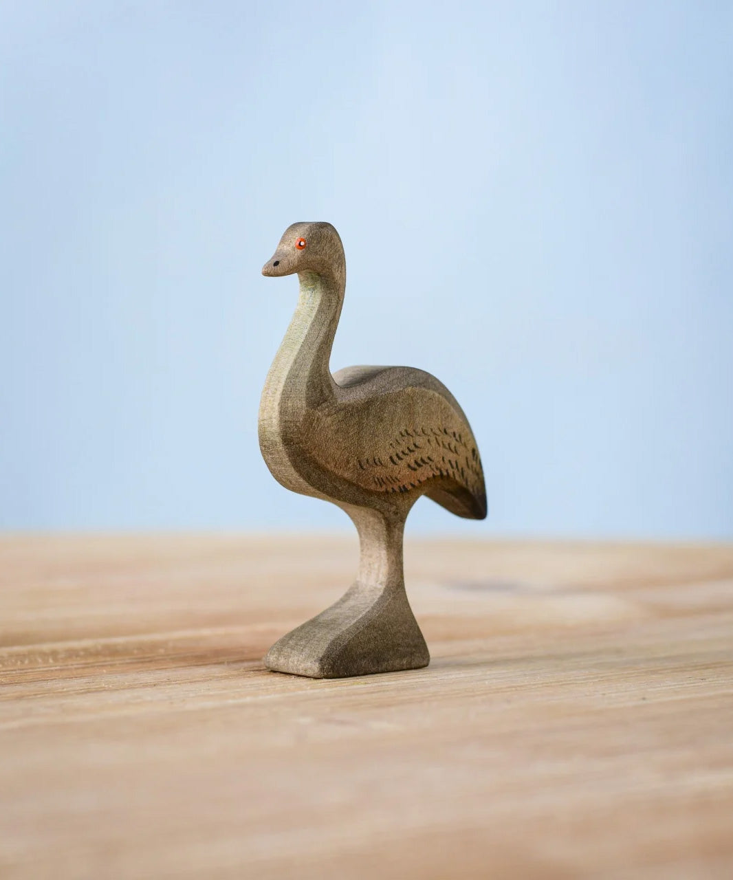 Bumbu wooden female emu figure standing on a wooden board