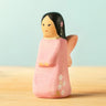 Bumbu handcrafted wooden cherry fairy figure with painted black hair, flowers and facial features