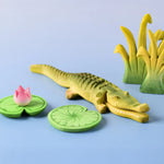 Bumbu's Wooden Crocodile in a scene with Bumbu Lilypads and Reed's, in large and small.