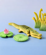 Bumbu's Wooden Crocodile in a scene with Bumbu Lilypads and Reed's, in large and small.
