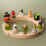 A complete celebration ring showing the different Bumbu wooden halloween figures 