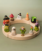 A complete celebration ring showing the different Bumbu wooden halloween figures 