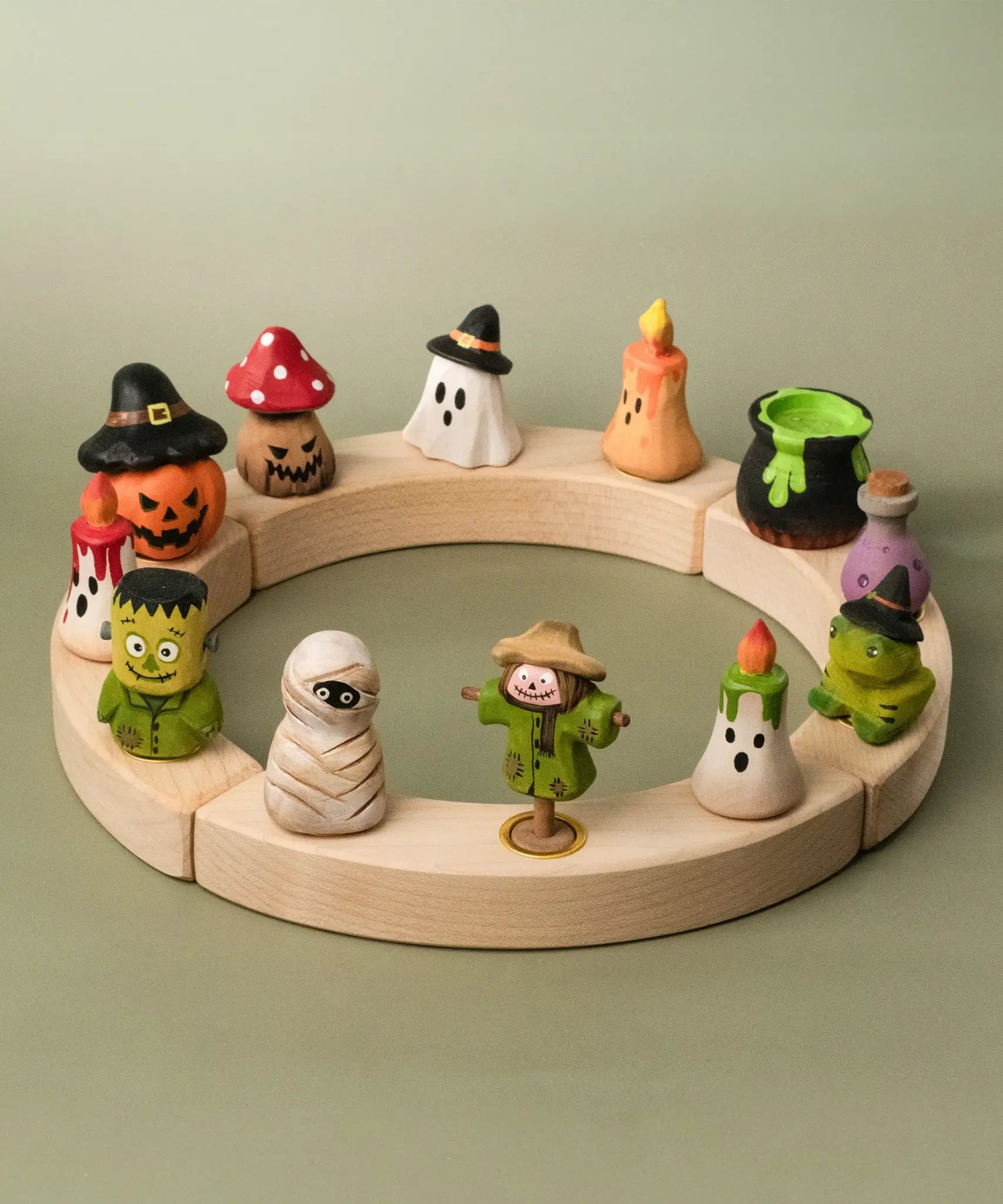 A complete celebration ring showing the different Bumbu wooden halloween figures 