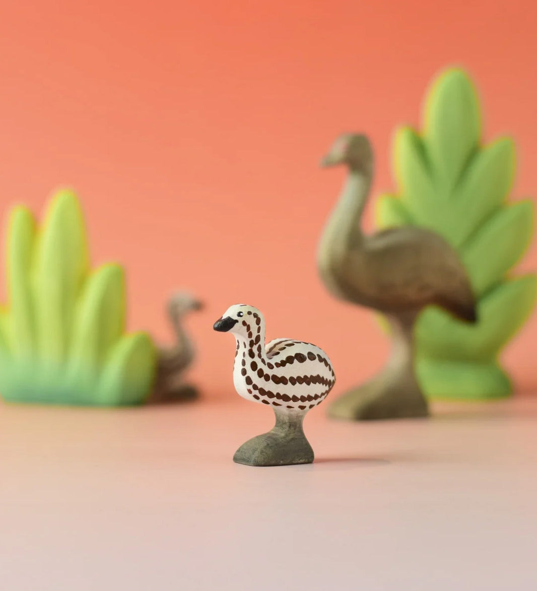 A Bumbu wooden emu chick in a nature play scene. 