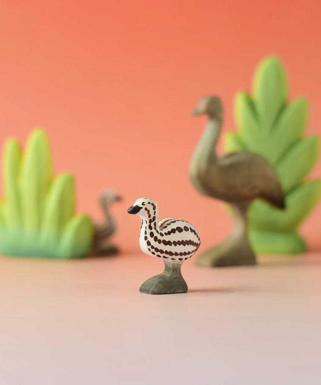 A Bumbu wooden emu chick in a nature play scene. 