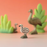 A Bumbu wooden emu chick in a nature play scene. 
