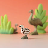 A Bumbu wooden emu chick in a nature play scene. 