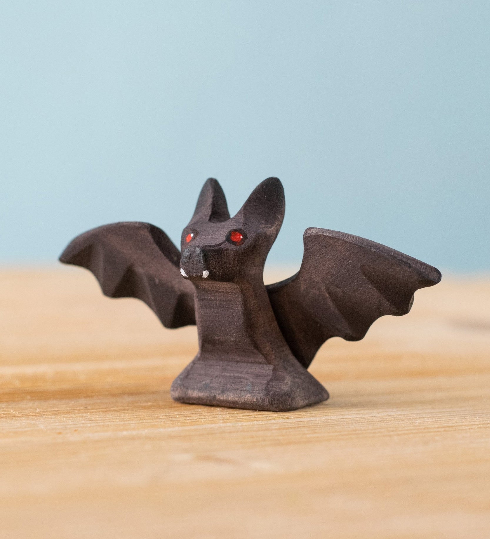 Bumbu handmade and hand painted wooden standing bat figure available at Babipur 