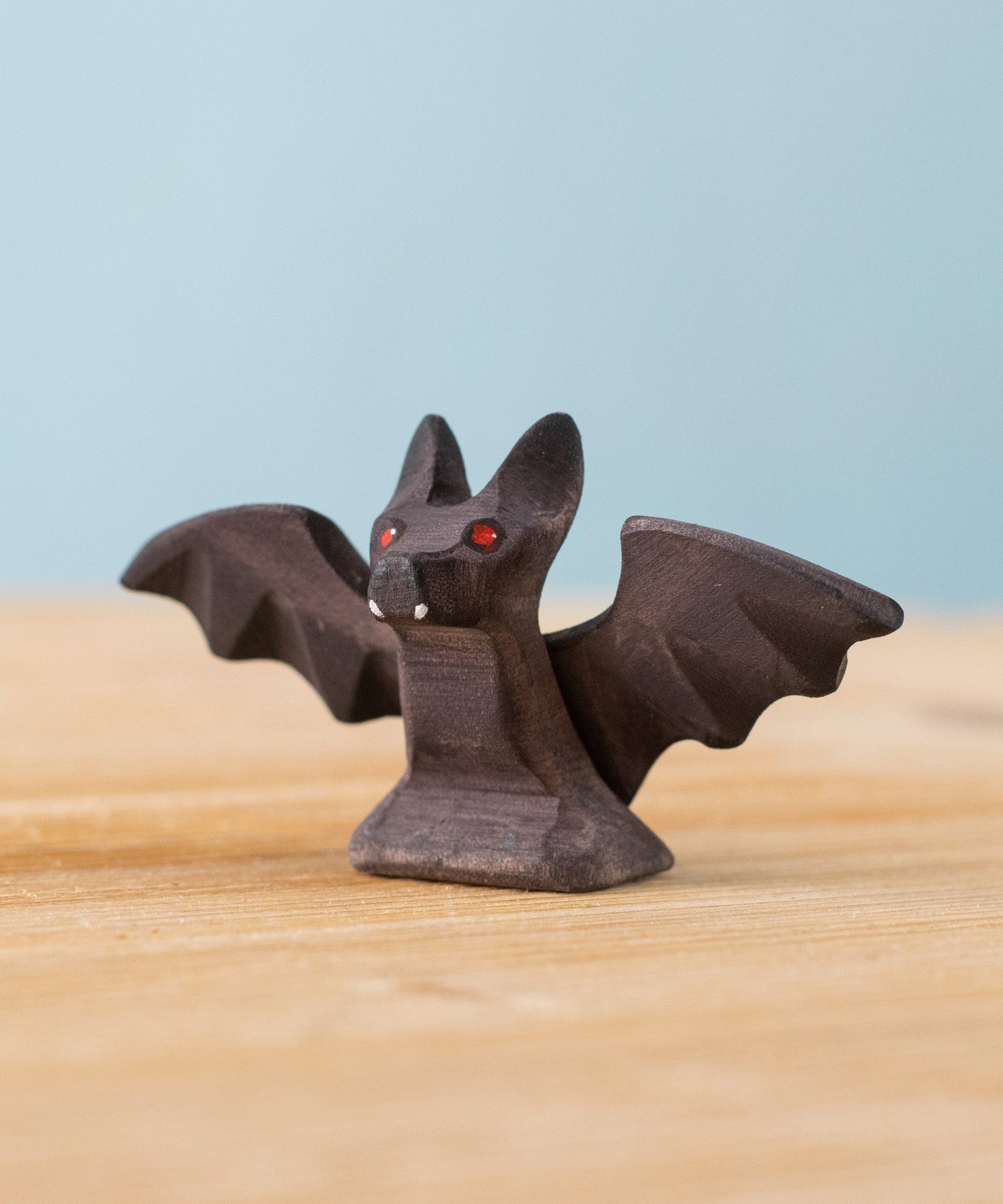 Bumbu handmade and hand painted wooden standing bat figure available at Babipur 