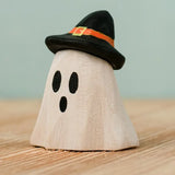 Bumbu handcrafted wooden ghost wizard decorative figure wearing a black hat.
